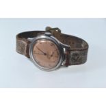 Vintage 1942 Longines Acier Inox stainless steel cased watch, with subsidiary seconds, copper colour