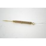 9ct gold engine turned propelling tooth pick, hallmarked Birmingham 2000, 6.33 grams