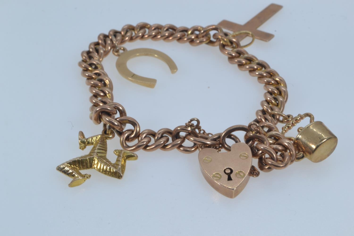 9ct rose gold bracelet with a heart-shaped padlock clasp, suspending four charms, including three 9c - Image 4 of 6