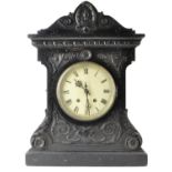 Oak cased Mantle clock with ornate carving H50cm W36.5cm D19cm