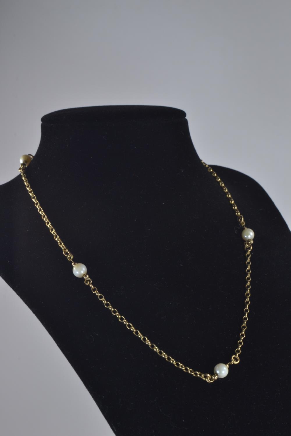 Yellow metal and pearl necklace, tests positive for 9ct gold, circumference 400mm, gross weight 6.45
