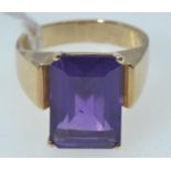 Yellow metal ring set with an emerald-cut amethyst, tests positive for 9ct gold, size O/P, gross wei