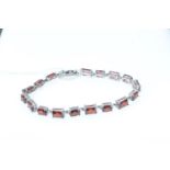 925 silver and orange stone tennis bracelet, circumference 200mm, gross weight 16.5 grams