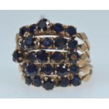 14ct gold articulated stacking ring set with twenty-five dark blue sapphires, size M, gross weight 7
