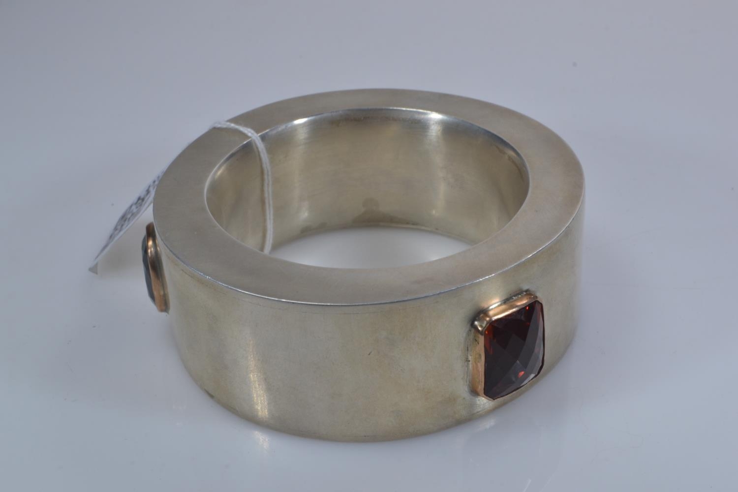 Custom made heavy white metal statement bangle, bezel-set with three large topaz stones, including b - Image 2 of 5