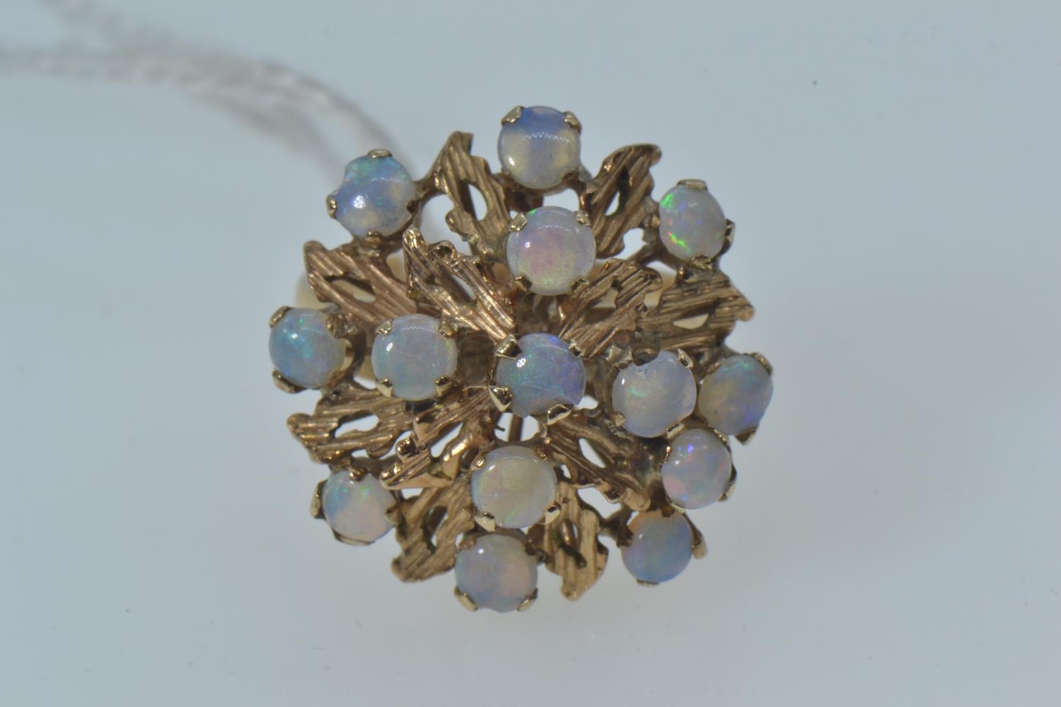 Opal cluster ring, the yellow metal mount testing positive for 9ct gold, with 14 opals of good colou - Image 3 of 6