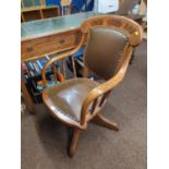 Early C20 oak swivel chair