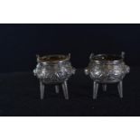 Pair of Chinese export silver salts, in the form of incense burners, with glass liners, indecipherab