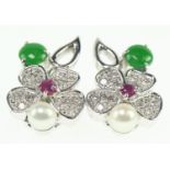 18ct gold white flower clip on earrings. Set with ruby, emerald, pearl and melee diamonds. Gross wei