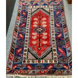 Dark blue and red geometric design rug W117 x L 194cm