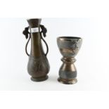 Two bronzed vessels, one vase and one challice style. Height of the vase H33cm