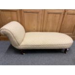 Chaise longue upholstered in Howard style material, braided finish with ceramic castors. L165 D66 H