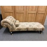 Antique upholstered chaise longue with ceramic castors. L195 D67 H at back 72cm