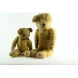 Merrythought jointed teddy bear circa. 1930's with original tag to foot, golden mohair, glass eyes,