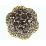 9ct gold and garnet dress ring of flower design, size N, gross weight 16.48 grams