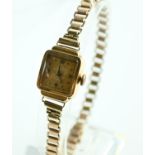 Titus ladies watch 18ct case on a 9ct gold strap. weight minus movement 11 g