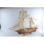 La Belle Poule model Ketch sailing yacht with calico sails and display stand. Overall length 82 cm T
