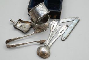 Cased pair of silver napkin rings, three mustard spoons, sugar nips, silver and mother-of-pearl frui