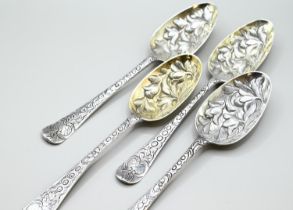 Four Georgian style silver berry spoons, each with partial hallmarks, later chased and gilded, initi