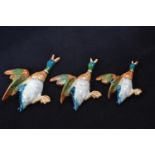 A set of three graduated Beswick flying duck wall pockets 596-2, 3 & 4