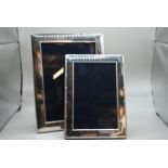 Two rectangular silver photo frames, Carr's of Sheffield Ltd, Sheffield 2002 and 2003 respectively,