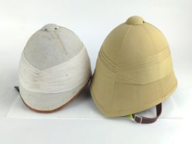 Two Replica Boer War Pith helmets.