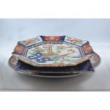 Six Imari patterned platters, oval platter 36cm x 27cm