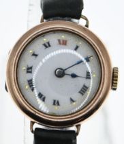 9ct gold cased ladies wristwatch with enamel face, dia. 26mm, on leather strap, gross weight 17.3 gr