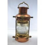 Brass and copper ships anchor oil lamp with thick glass lens H32cm