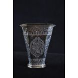Eastern white metal vase, of flared form, with floral and foliate decoration, height 10.4cm, 98.9 gr