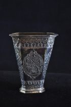 Eastern white metal vase, of flared form, with floral and foliate decoration, height 10.4cm, 98.9 gr