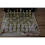 Onyx chess board 41x41cm and chess pieces in a velvet purpose made case.