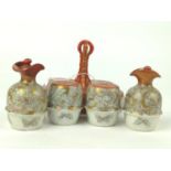 Three pieces Japanese Kutani ceramics, including cruet set, trinket pot and small footed dish