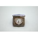 Silver and blue enamel mounted travel clock, John William Barrett, Birmingham 1936, 5 x 4.5cm