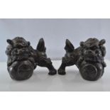 Pair of bronzed, heavy resin Foo Dogs with good detail. 11cm high x 13cm across.