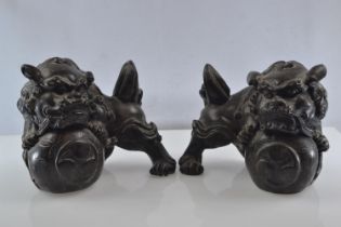 Pair of bronzed, heavy resin Foo Dogs with good detail. 11cm high x 13cm across.