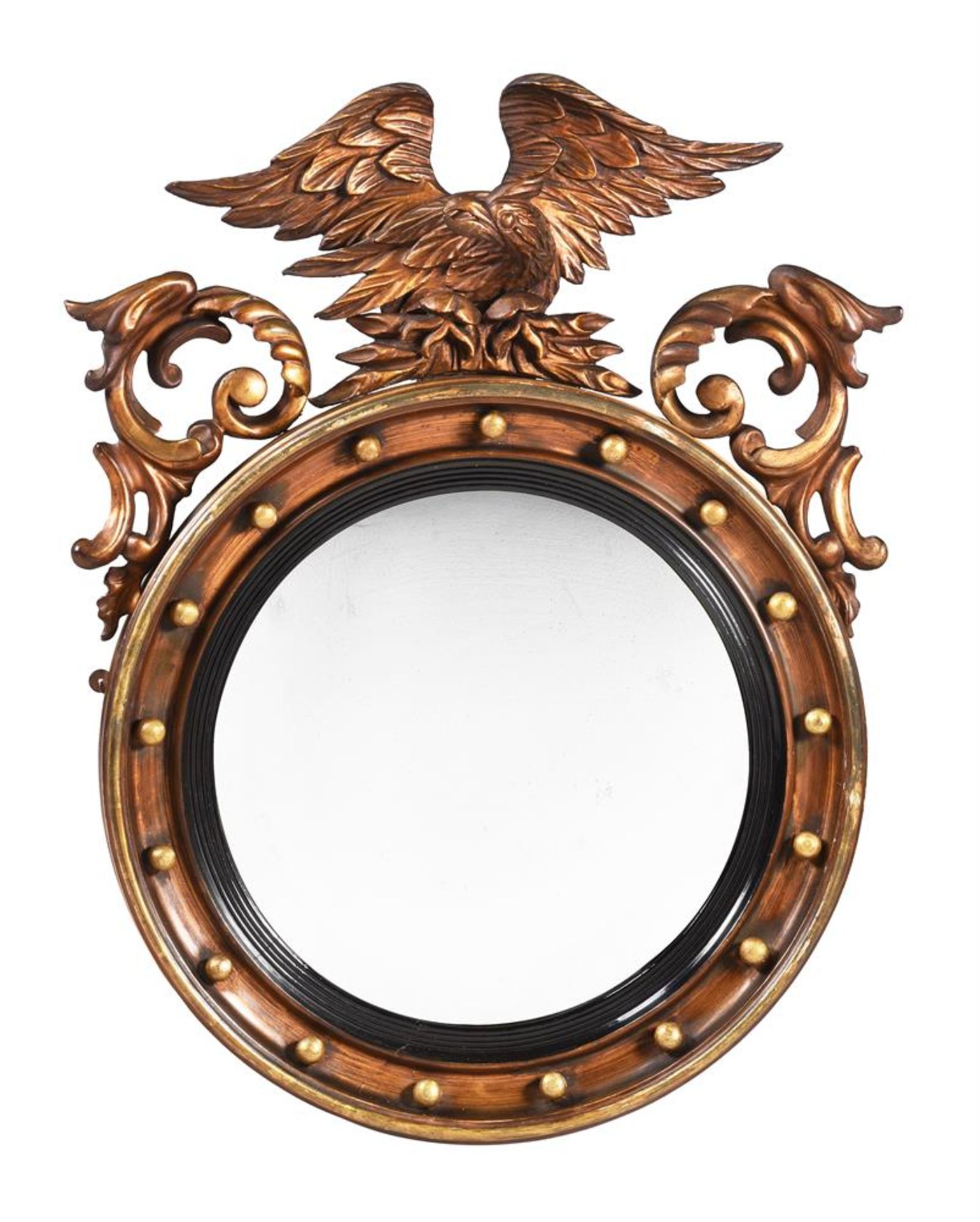 A GILTWOOD CONVEX WALL MIRROR IN REGENCY STYLE