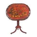 A RED JAPANNED AND GILT DECORATED TRAY TOPPED TABLE