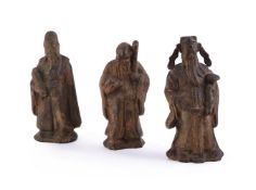 THREE CHINESE CAST-IRON MODELS OF DEITIES