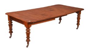 A VICTORIAN MAHOGANY EXTENDING DINING TABLE