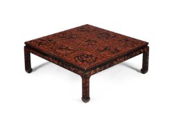 A BLACK LACQUER AND RED PAINTED LOW CENTRE TABLE