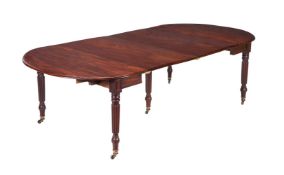 A GEORGE IV MAHOGANY EXTENDING DINING TABLE