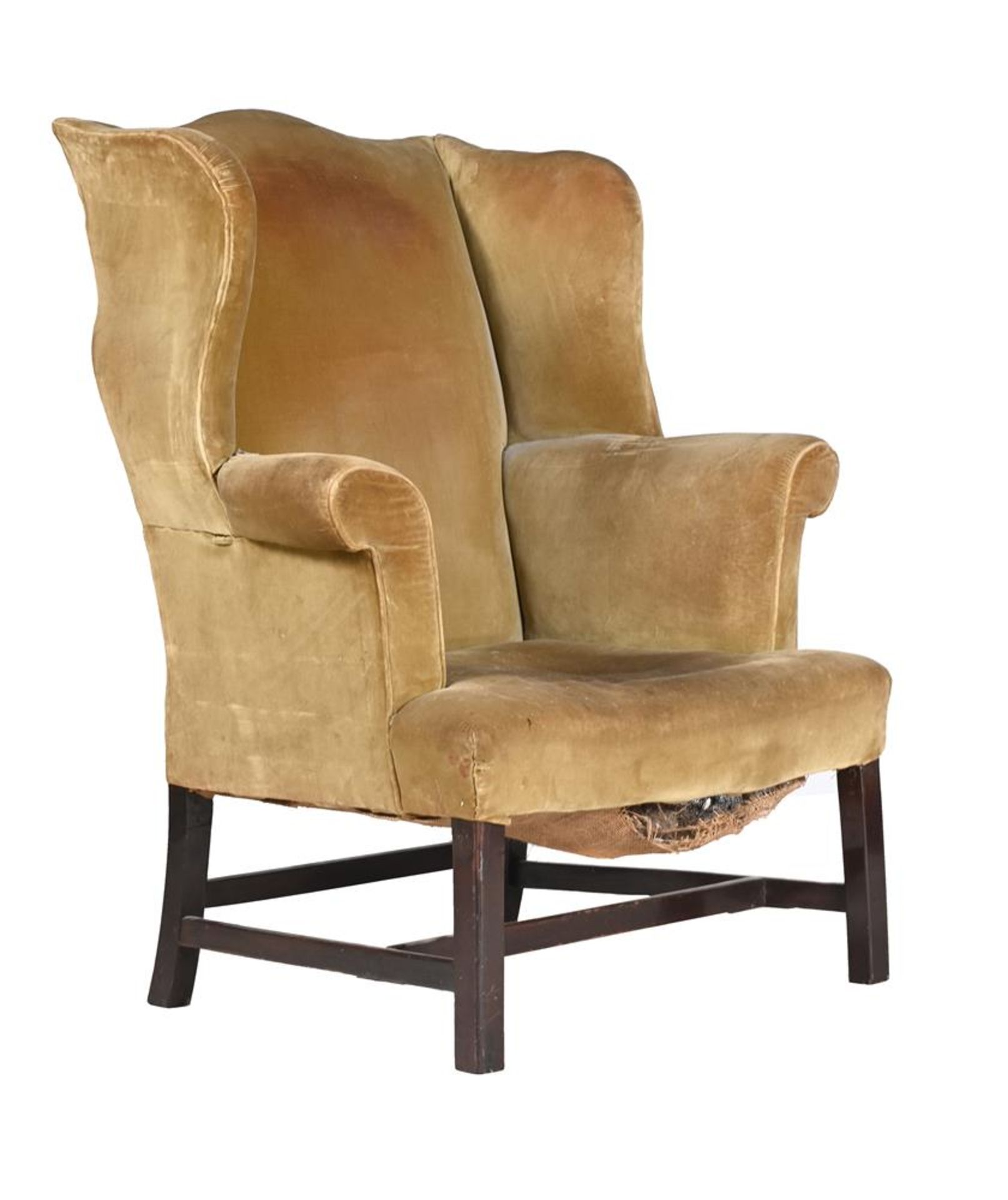 A GEORGE III MAHOGANY AND UPHOLSTERED WING ARMCHAIR