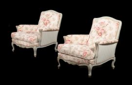 A PAIR OF FRENCH PAINTED AND UPHOLSTERED ARMCHAIRS IN LOUIS XV STYLE