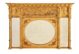 A GILTWOOD AND COMPOSITION OVERMANTEL WALL MIRROR IN REGENCY STYLE
