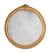 A VICTORIAN GILTWOOD AND COMPOSITION WALL MIRROR