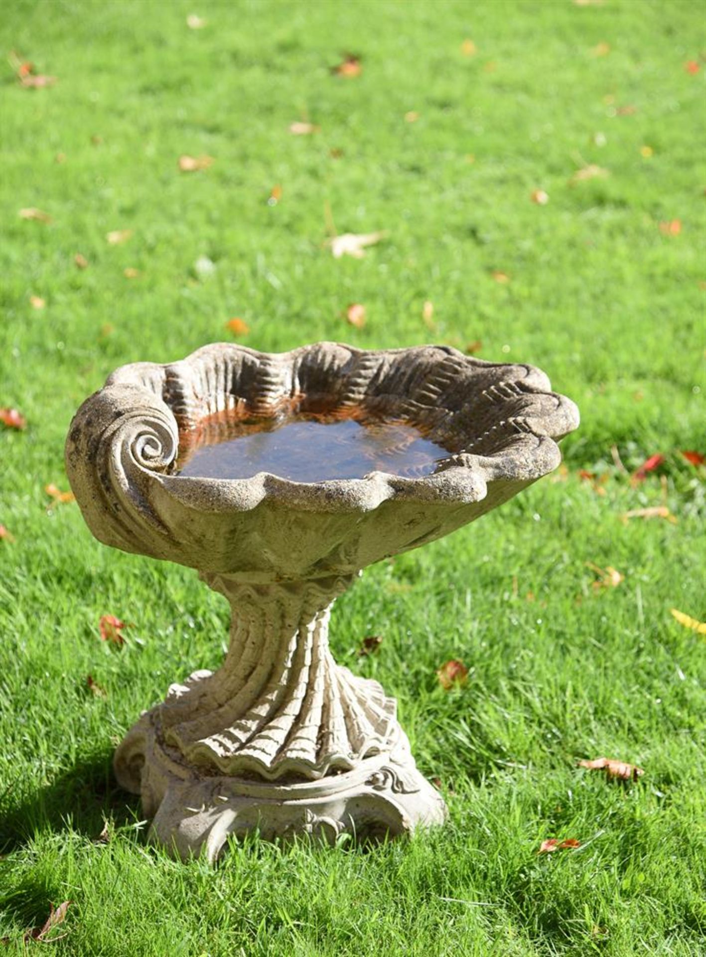 A COMPOSITE STONE BIRDBATH