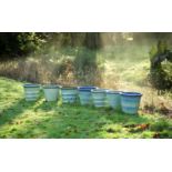 A GROUP OF SEVEN PALE TURQUOISE GLAZED PLANTERS