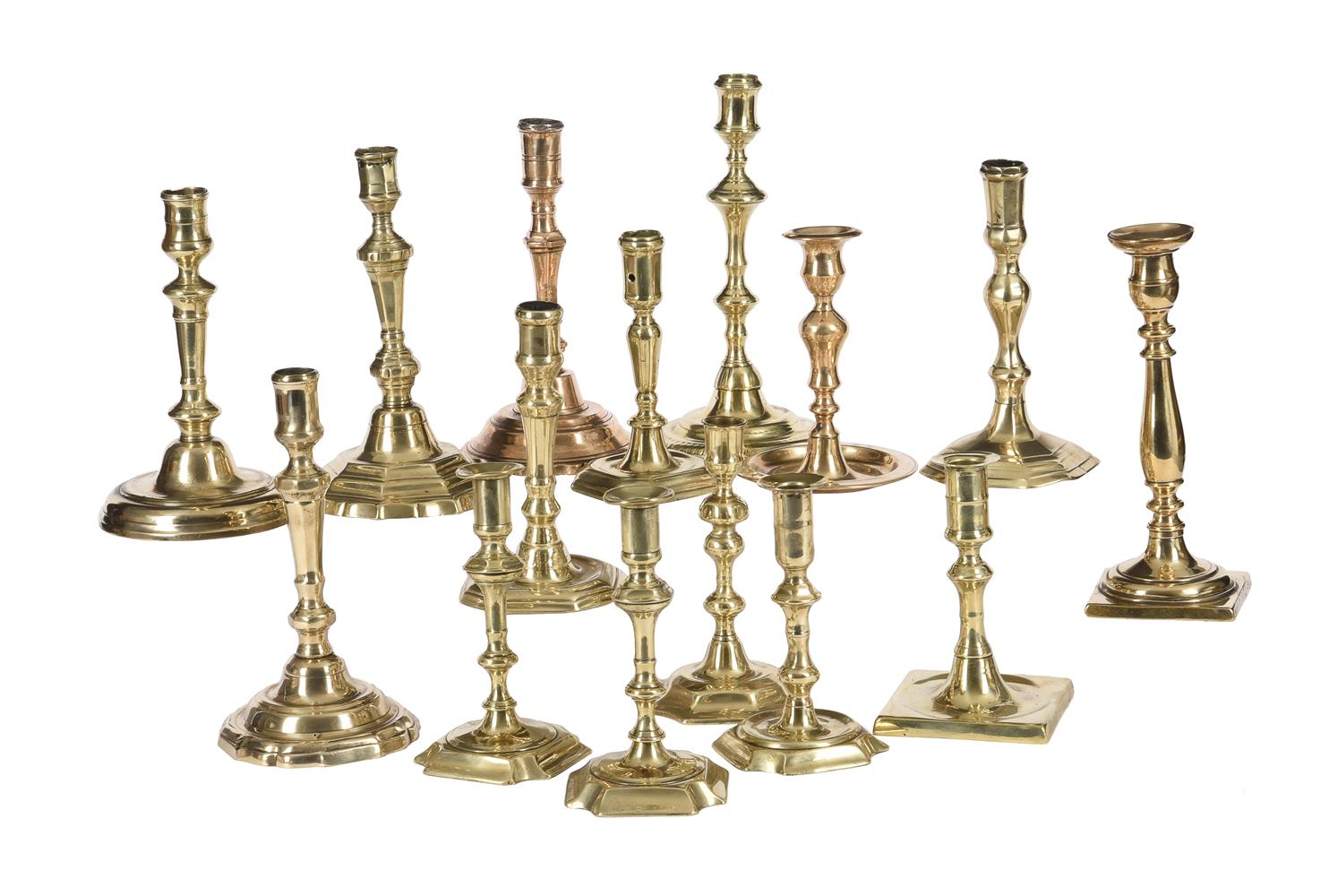 A COLLECTION OF FIFTEEN VARIOUS BRASS CANDLESTICKS