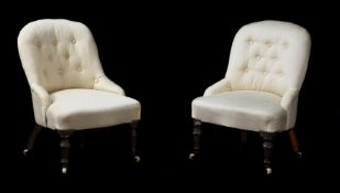 A PAIR OF VICTORIAN WALNUT AND CREAM UPHOLSTERED NURSERY ARMCHAIRS